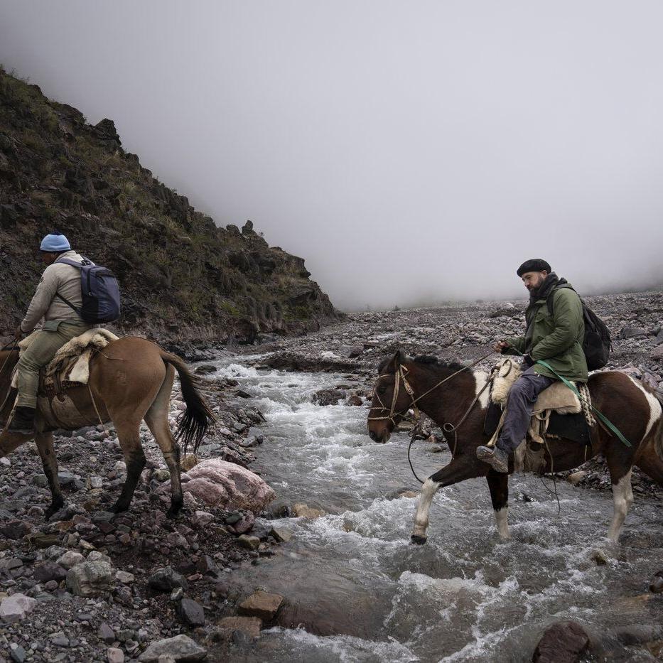 AP PHOTOS: A rural doctor traverses mountainous terrain by donkey to visit far-flung patients